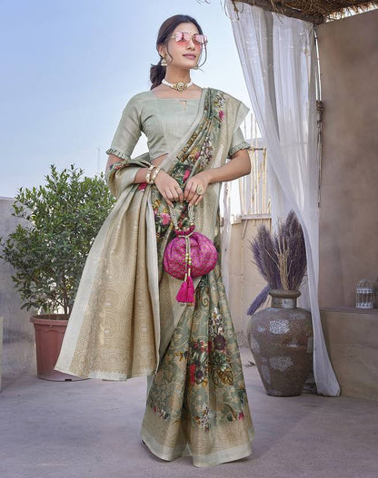 Graceful Sage Green Floral Saree with Elegant Woven Border