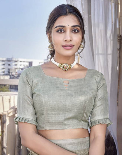 Graceful Sage Green Floral Saree with Elegant Woven Border