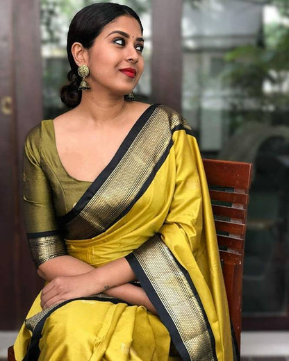 Graceful Yellow and Olive Silk Saree with Classic Border